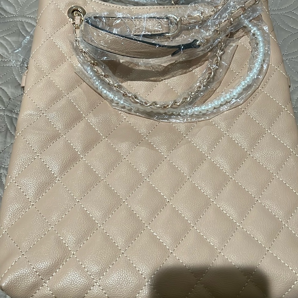 Tan with a long chain strap and pearl and short chain strap